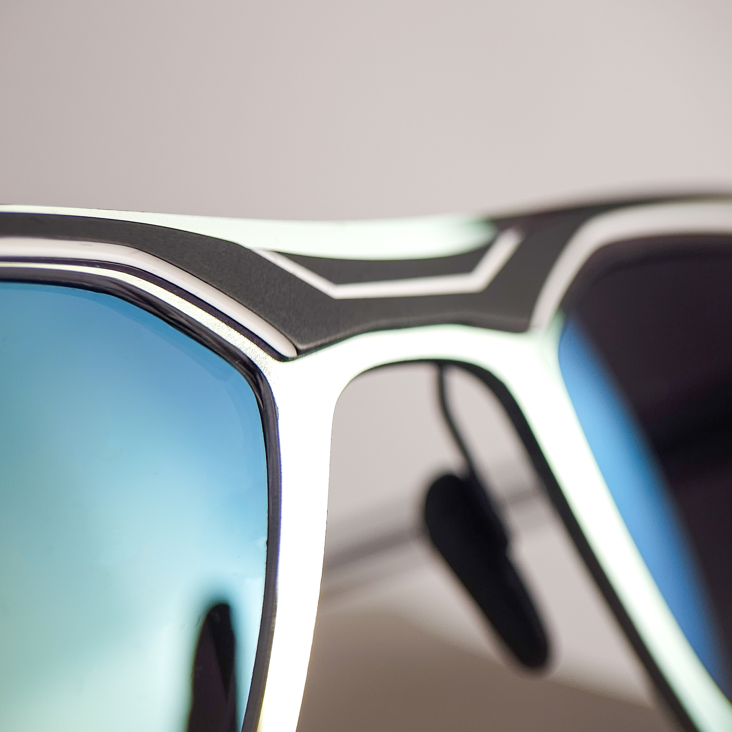 Parasite Astro 1 frame reglazed with bespoke ZEISS AdaptiveSun photochromic lenses featuring a Jade Flash Mirror finish by Lens Art luxury reglazing service.