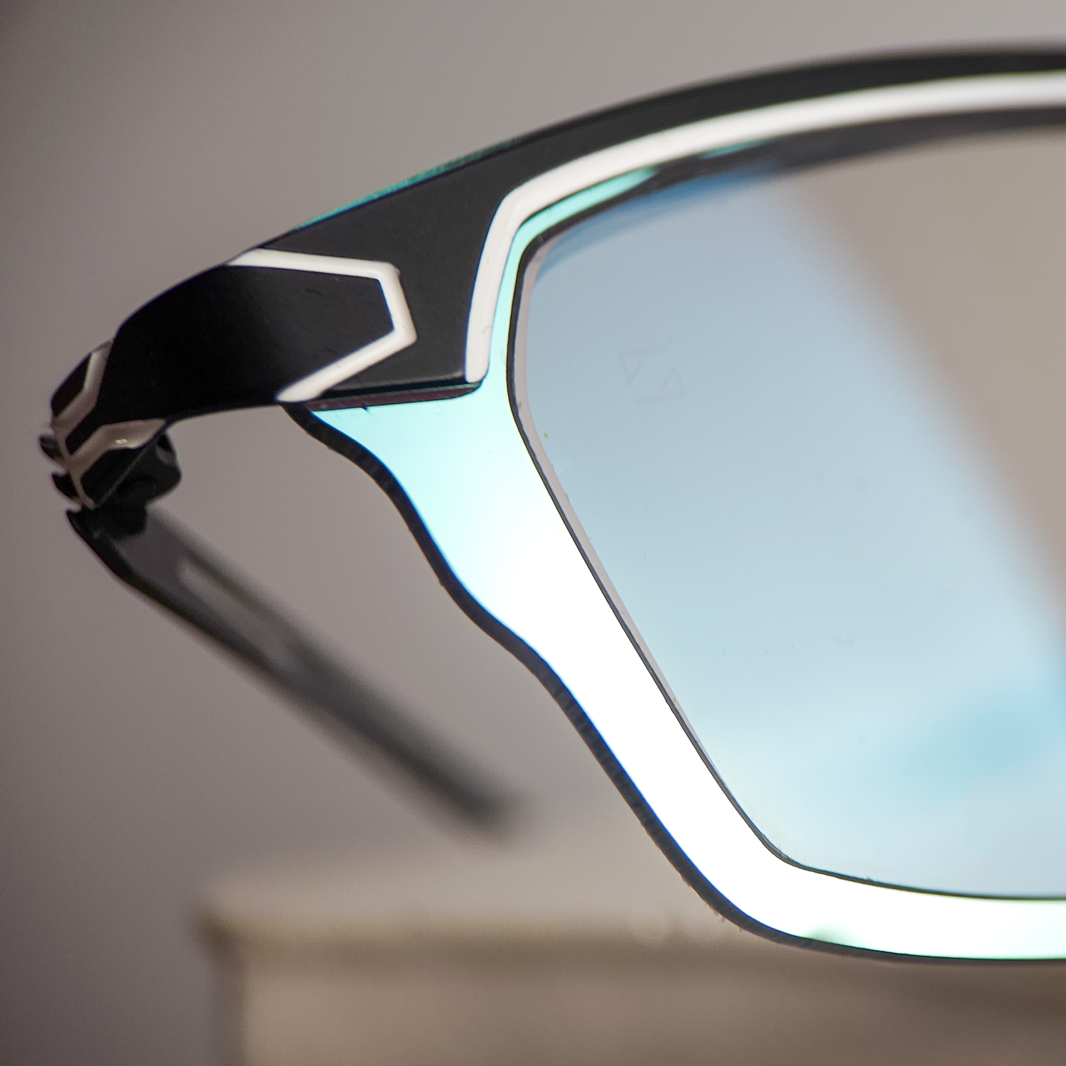 Parasite Astro 1 frame reglazed with bespoke ZEISS PhotoFusion X photochromic lenses featuring a Jade flash mirror finish by Lens Art luxury reglazing service.