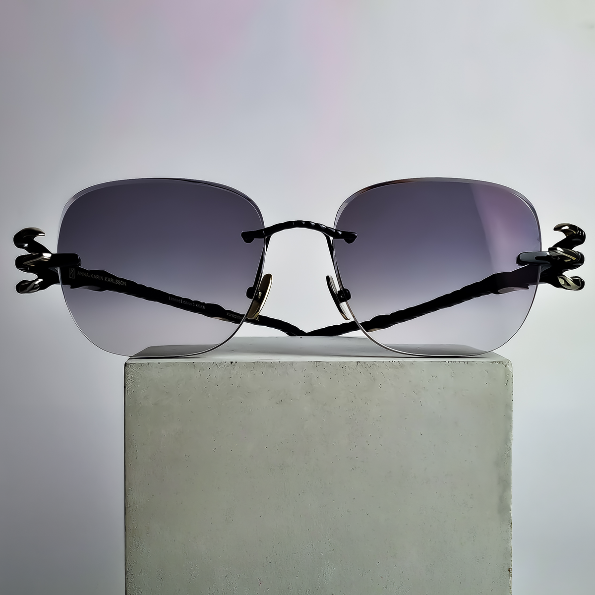Anna-Karin Karlsson Claw with bespoke smoky grey graduated prescription lenses before photochromic activation
