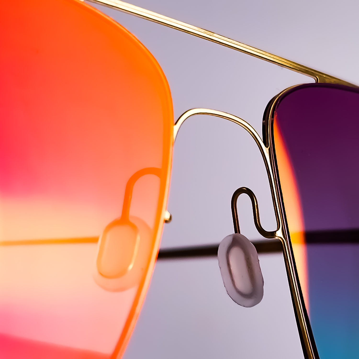 Lucas de Staël Fuse eyewear with bespoke custom tinted Marma Dinamica photochromic lenses and red flash mirror finish, individually designed through Lens Art® at The Optical Gallery.
