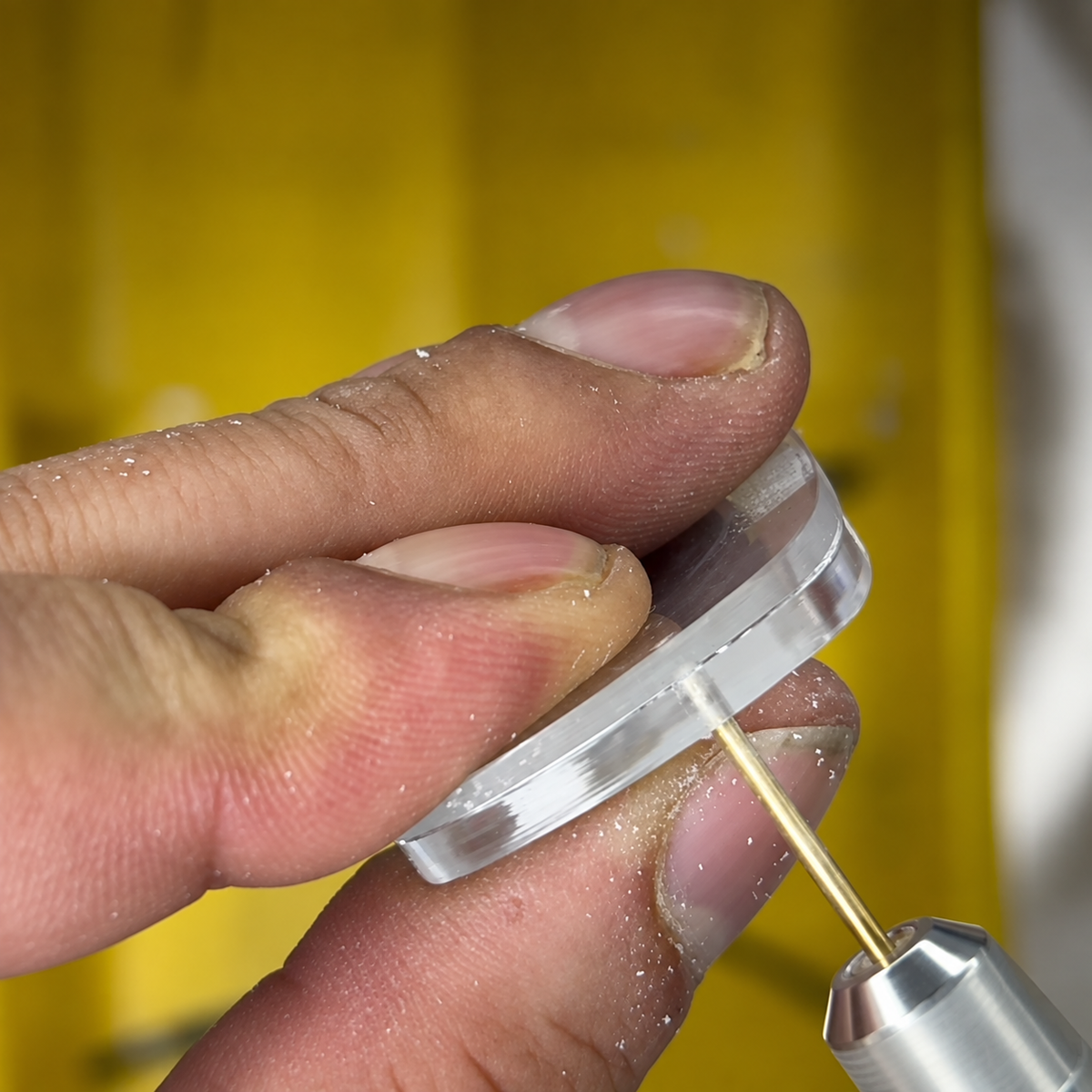 Precision drilling of a custom rimless prescription lens for luxury reglazing